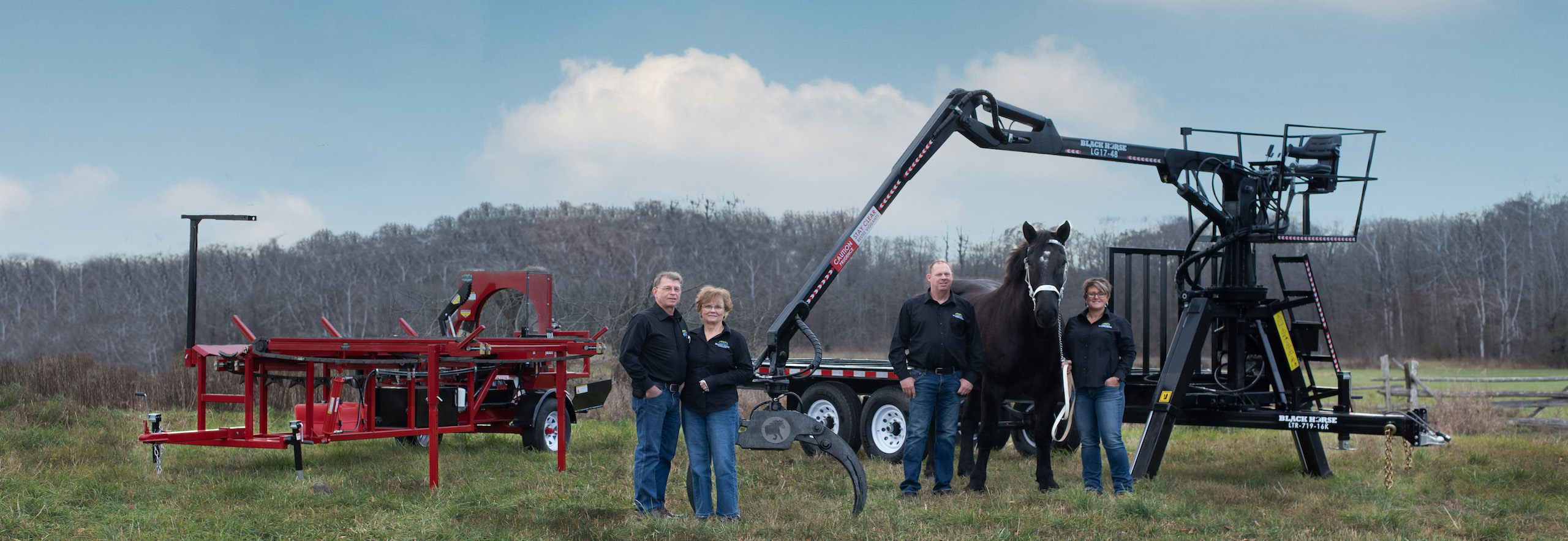 Photo of Black Horse Trailers grapple trailer and our 2500 firewood processor with live deck